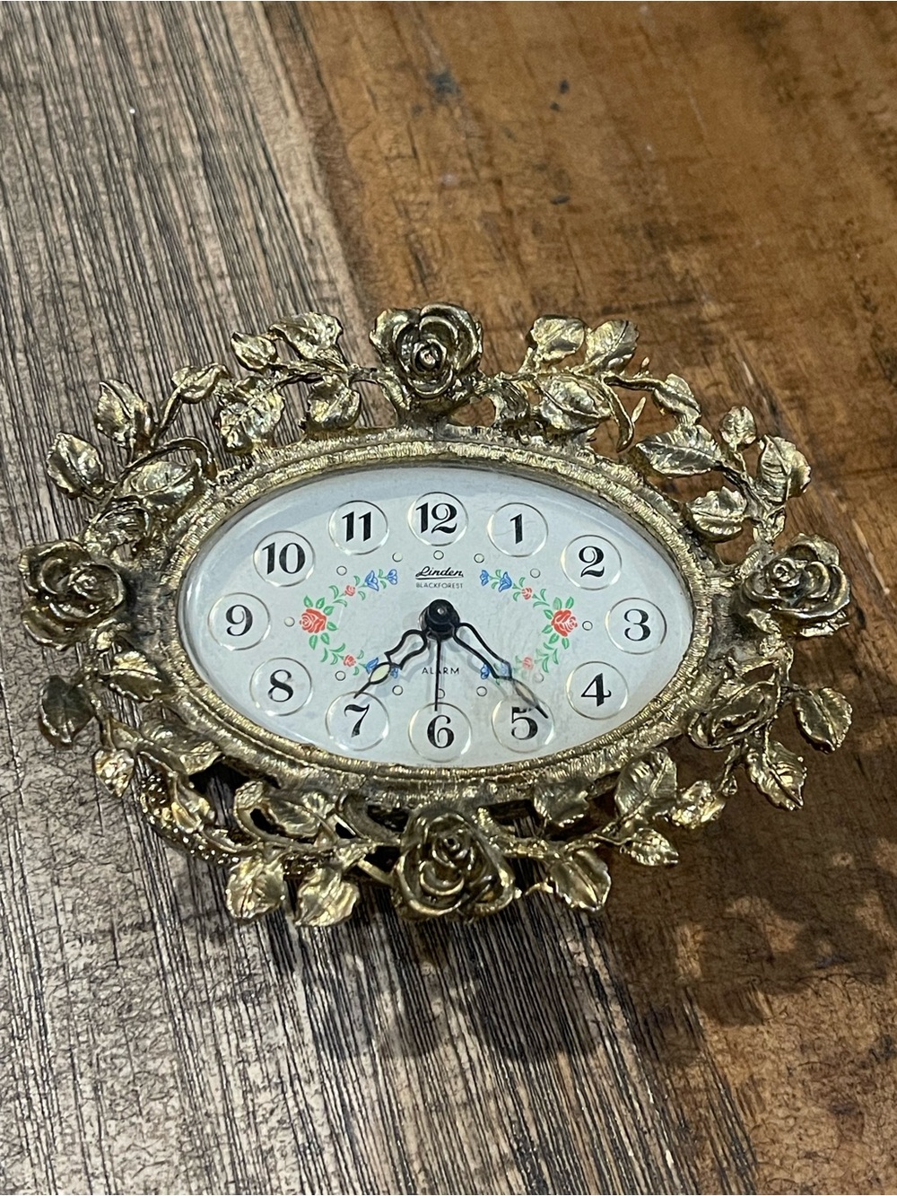 Linden Gold Floral Oval Wall Clock with White Dial